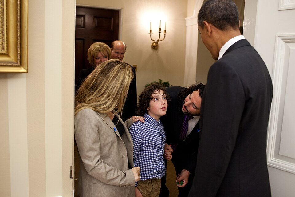 President Barack Obama greets Jasper Mann and his parents, Billy and Gena Mann, before signing H.R. 2005 - Combating Autism Reauthorization Act of 2011, in the Oval Office, Sept. 30, 2011. (Official White House Photo by Pete Souza)